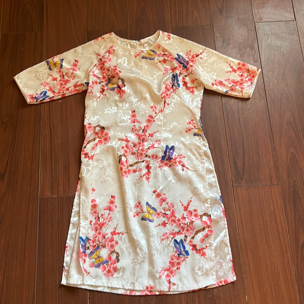 100% silk white floral white dress with side slits on both sides.